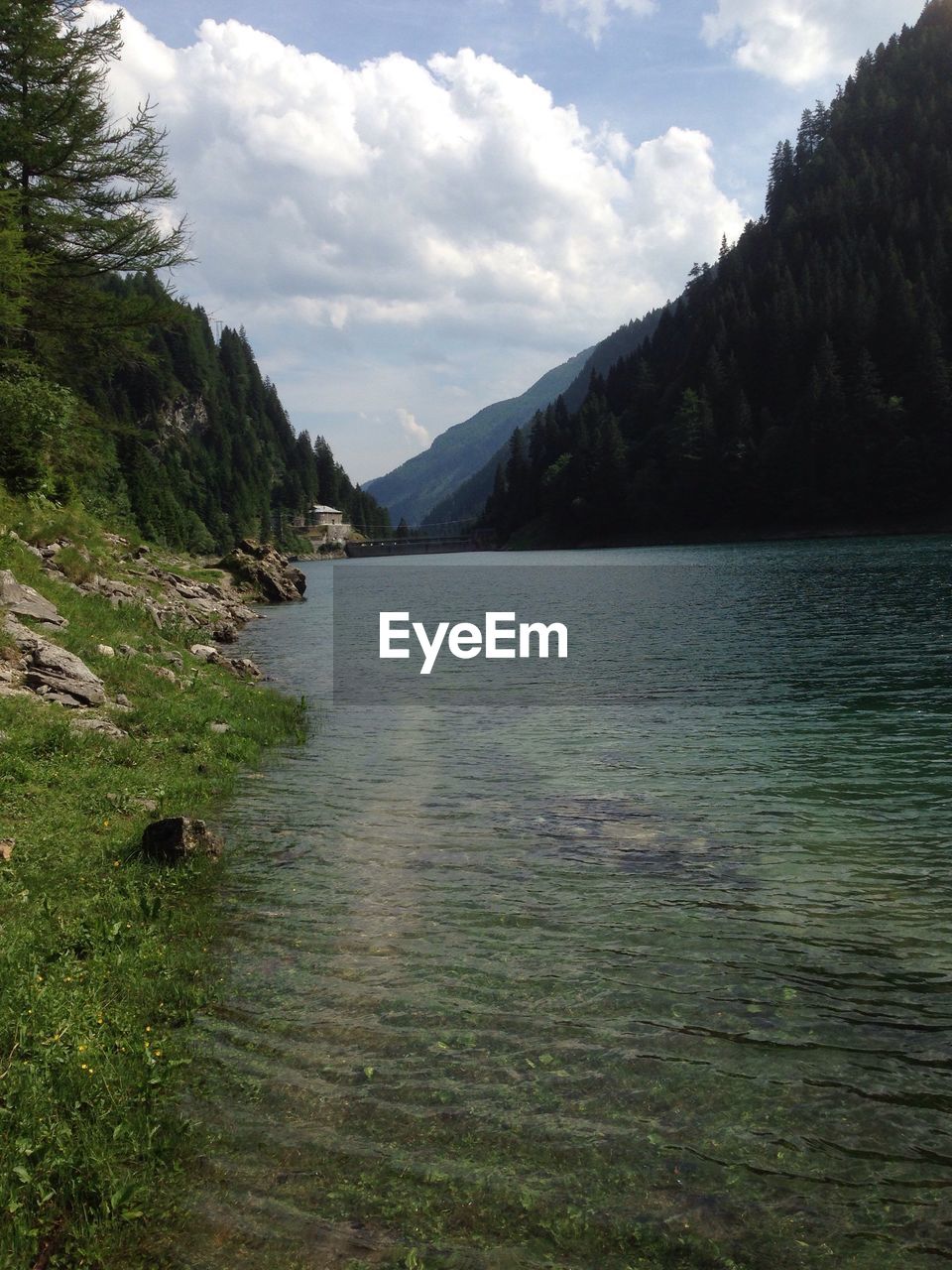 SCENIC VIEW OF RIVER AND MOUNTAINS