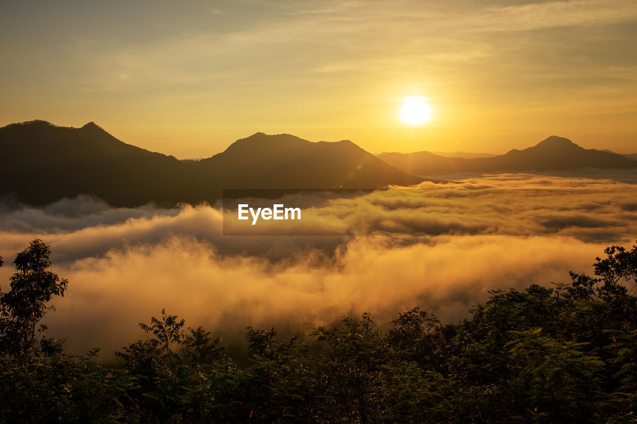 Scenic view of mountains against sky during sunset