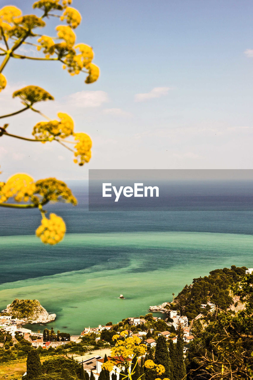 Scenic view of sea against cloudy sky