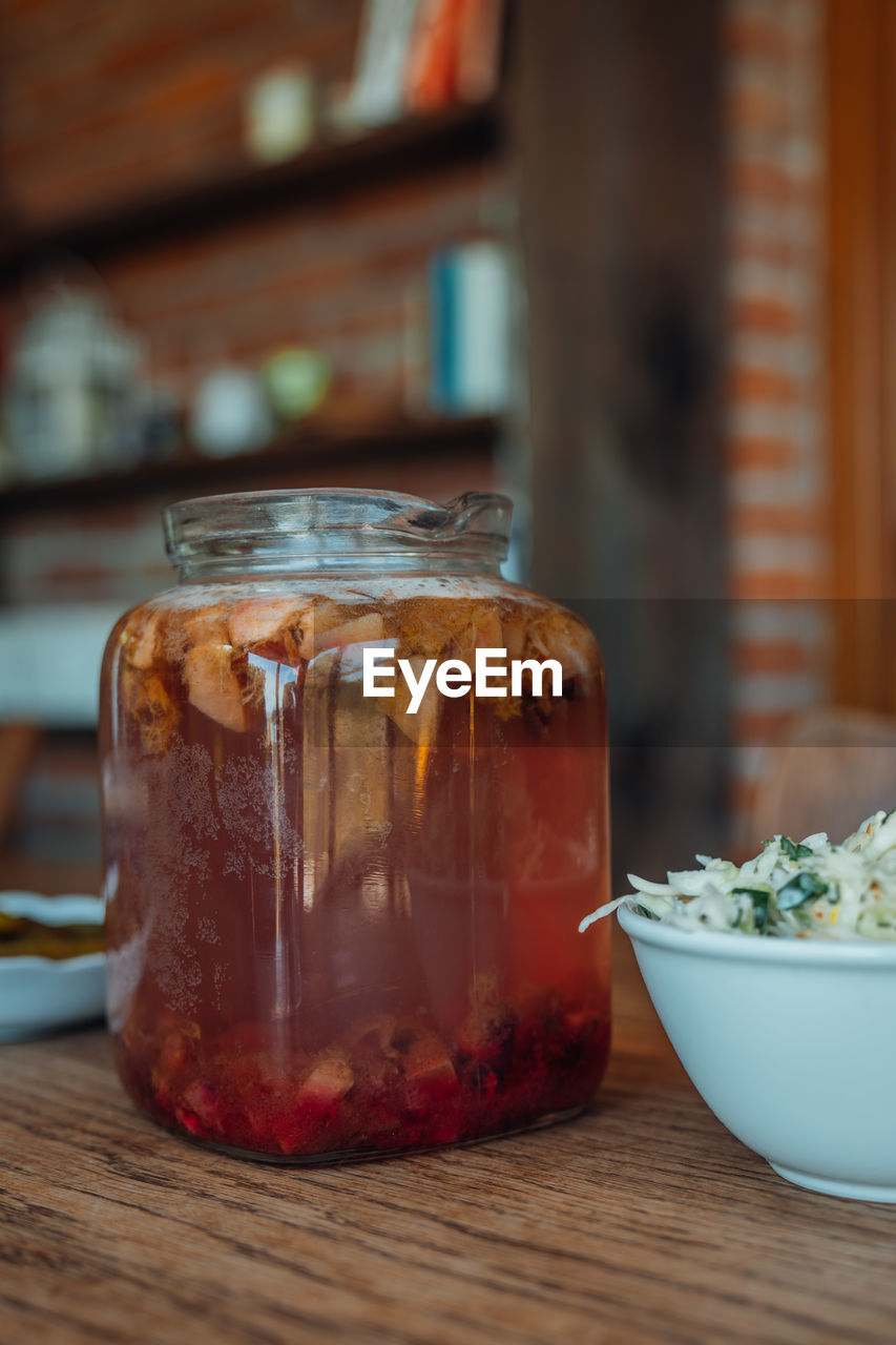 food and drink, food, healthy eating, wood, indoors, wellbeing, freshness, jar, table, produce, container, no people, focus on foreground, drink, fruit, glass, meal, mason jar, close-up, refreshment