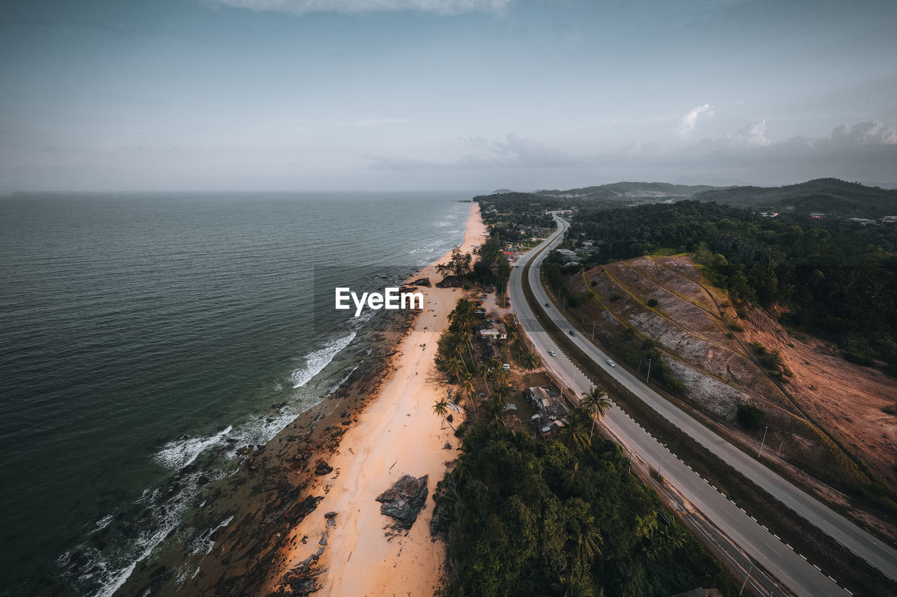 High angle view of road by sea against sky