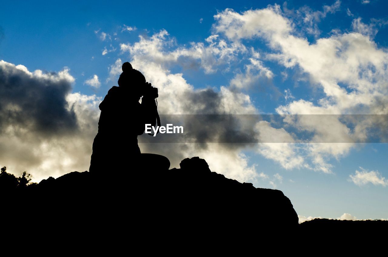 Silhouette of photographer at work