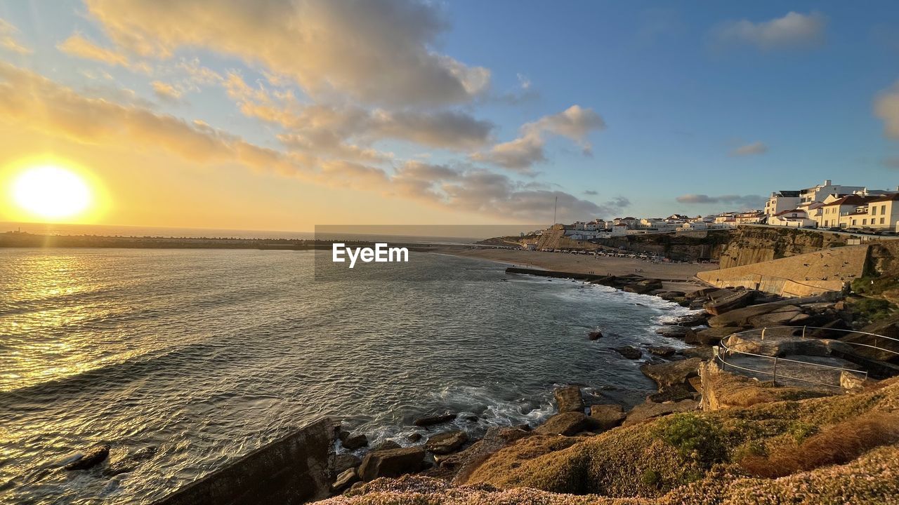 SCENIC VIEW OF SEA AGAINST SUNSET SKY