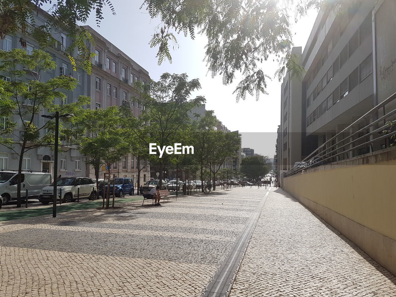 Street amidst buildings against sky