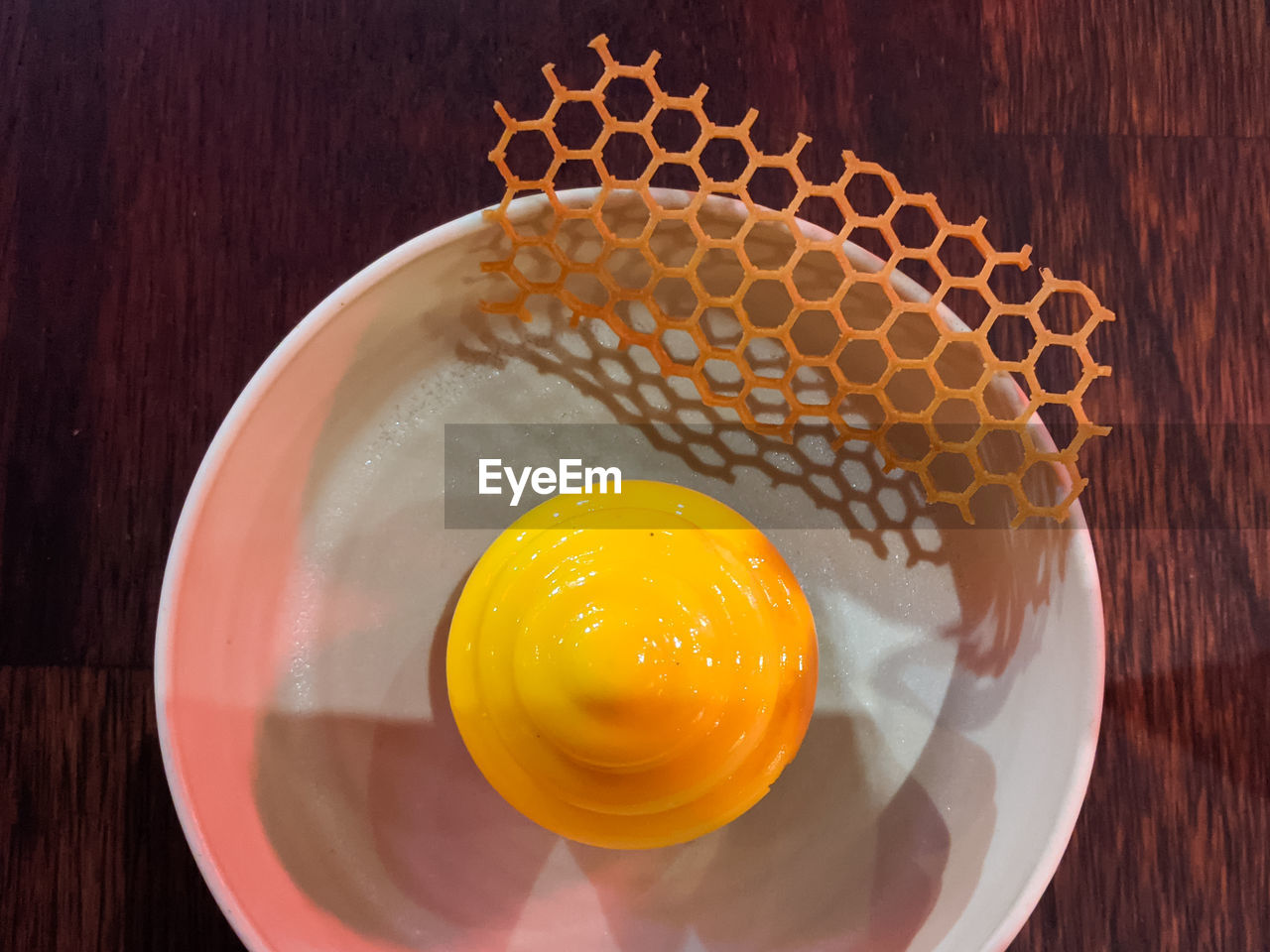food and drink, food, yellow, wood, table, produce, healthy eating, freshness, indoors, directly above, egg yolk, no people, egg, wellbeing, sweet food, still life, close-up, plant, bowl, high angle view, orange, geometric shape, kitchen utensil, circle, orange color, fruit, household equipment
