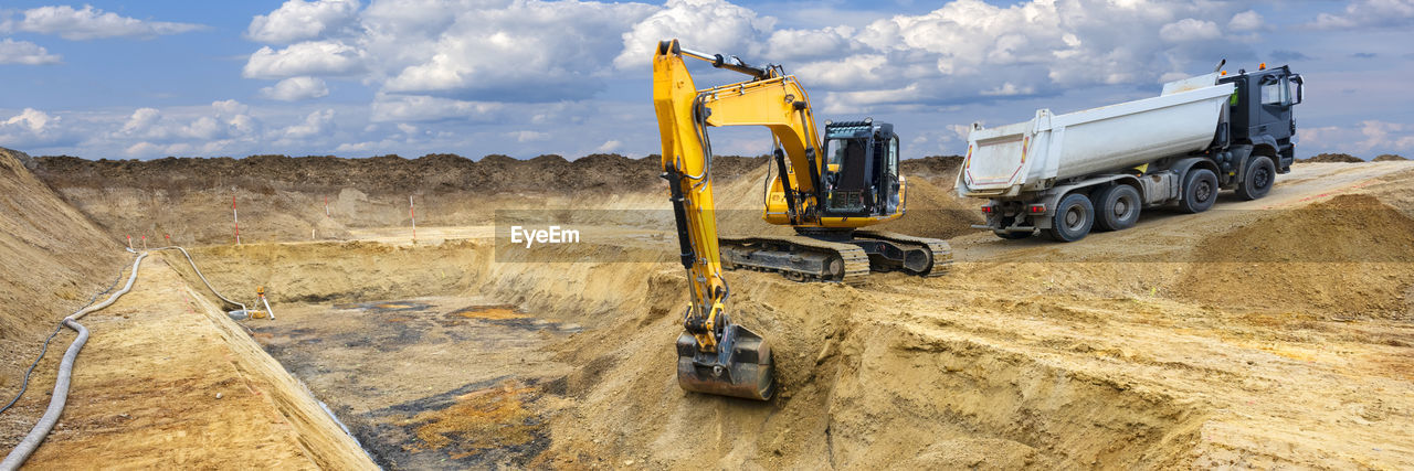 Excavator is working and digging at construction site