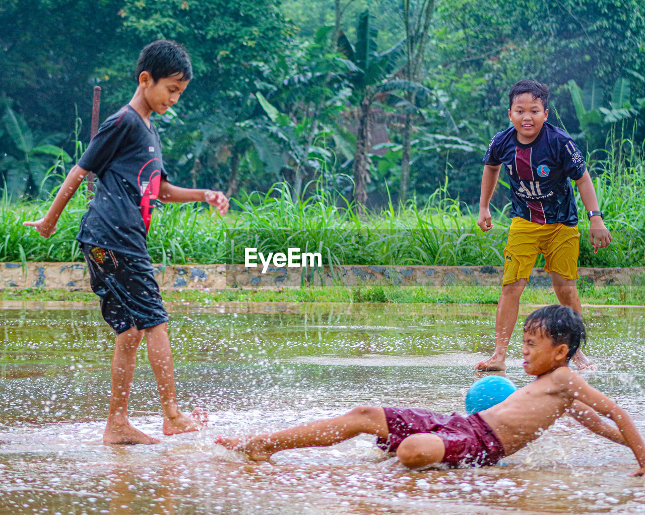 Side view of boy playing in water