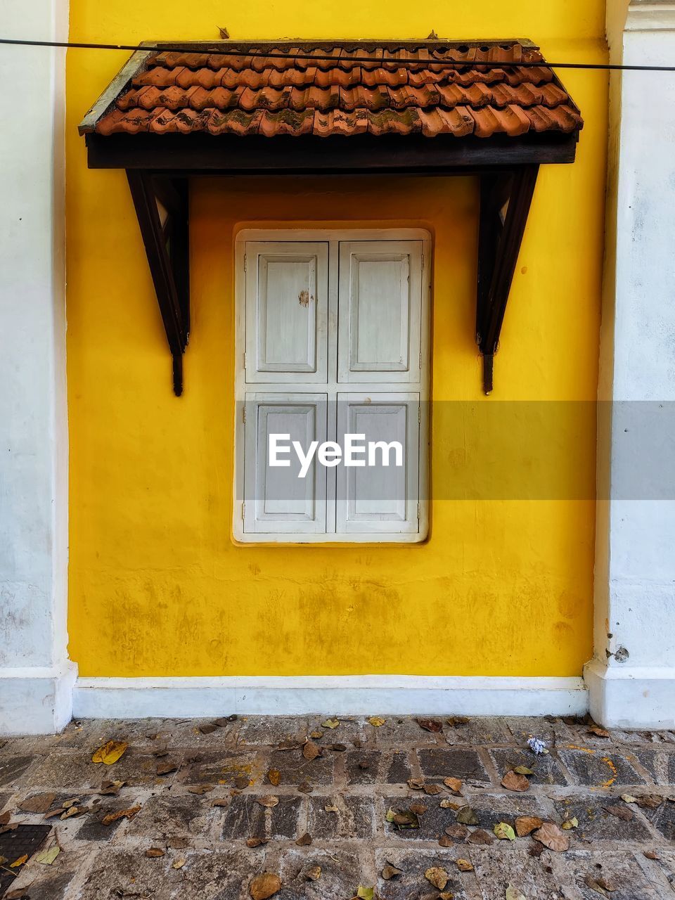 architecture, yellow, building exterior, built structure, building, house, door, residential district, no people, entrance, window, wood, wall - building feature, wall, facade, closed, day, outdoors, city, security, protection, home, old