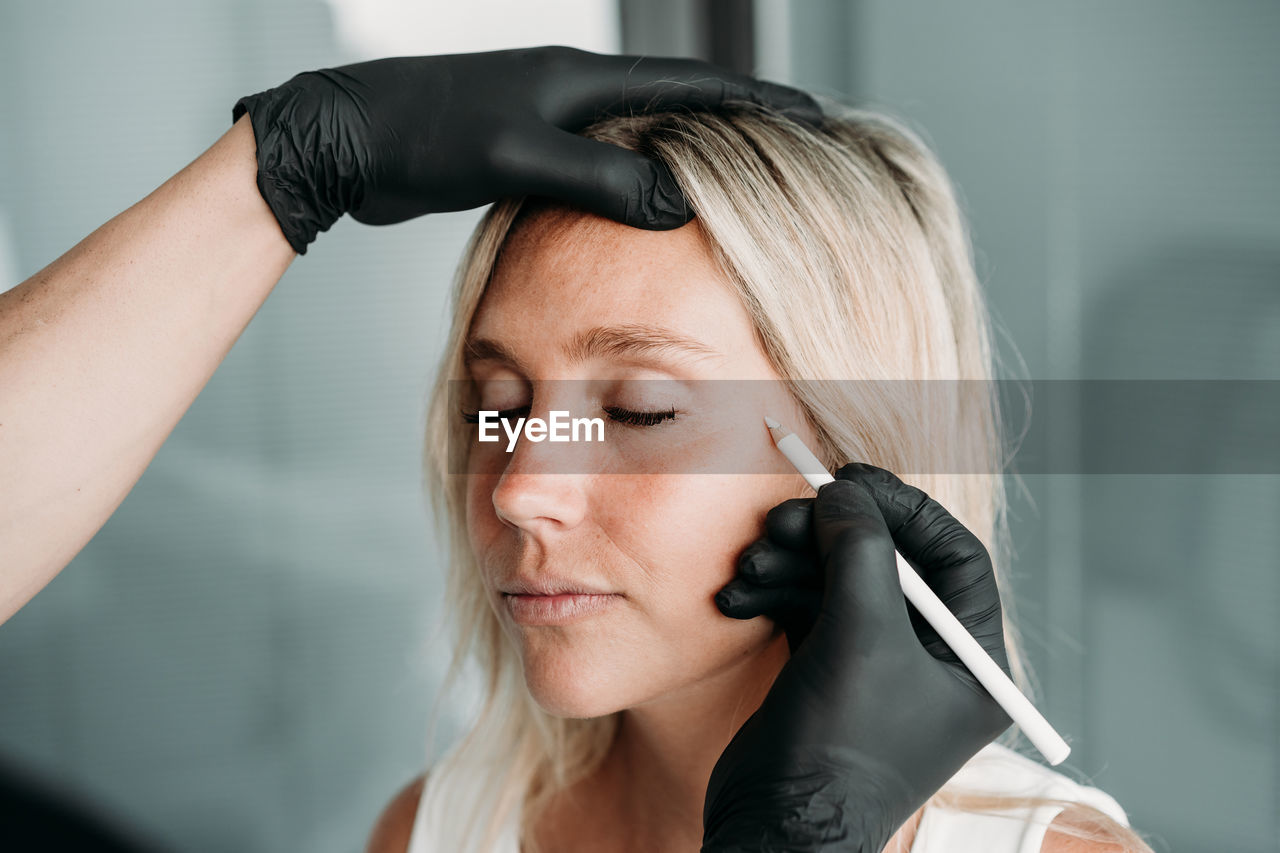 Young woman gets beauty facial injections in salon or clinic. skincare concept