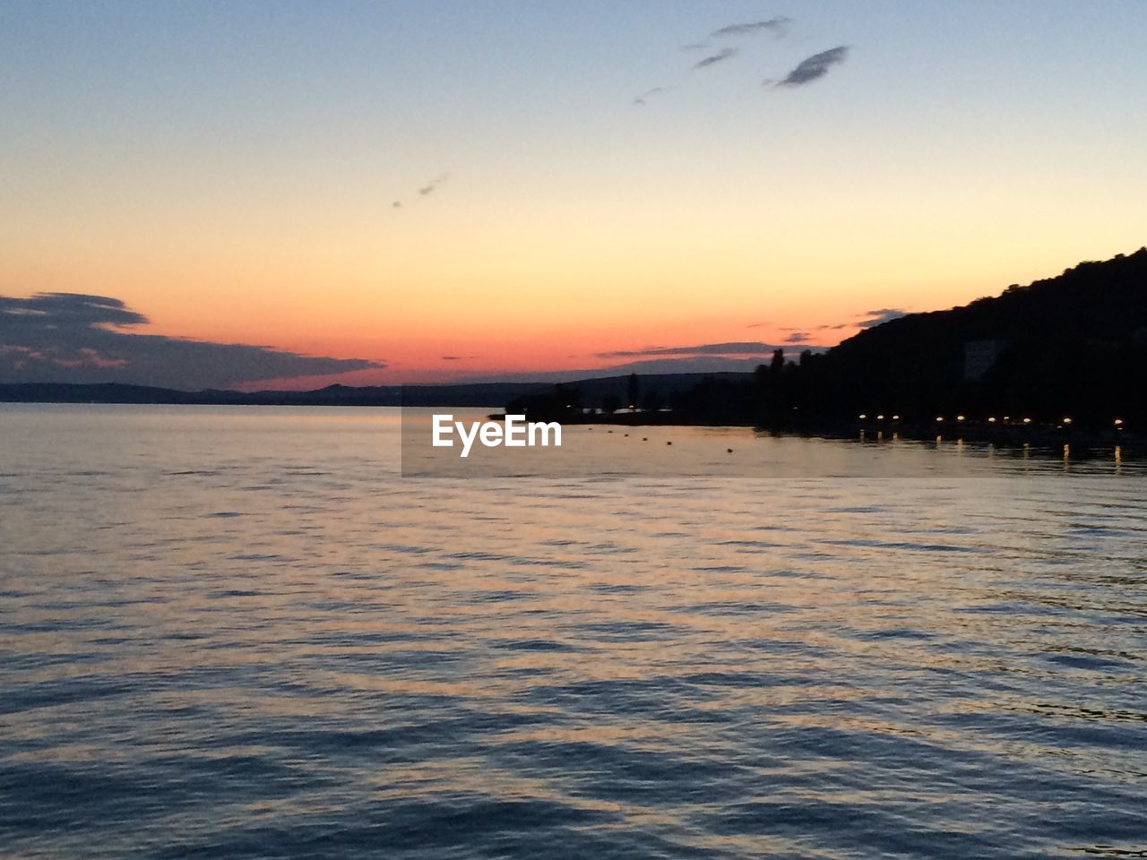 VIEW OF SEA AT SUNSET