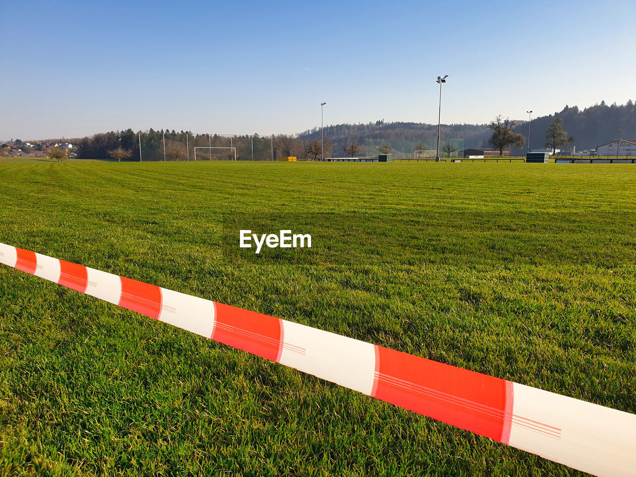 SCENIC VIEW OF AGRICULTURAL FIELD AGAINST CLEAR SKY