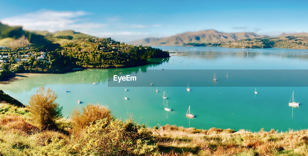 water, scenics - nature, lake, nature, reflection, sky, mountain, environment, beauty in nature, body of water, plant, landscape, land, tranquility, tranquil scene, travel destinations, no people, reservoir, travel, day, tree, shore, outdoors, beach, coast, blue, cloud, tourism, non-urban scene, bay, mountain range, idyllic, nautical vessel, crater lake, morning, lagoon