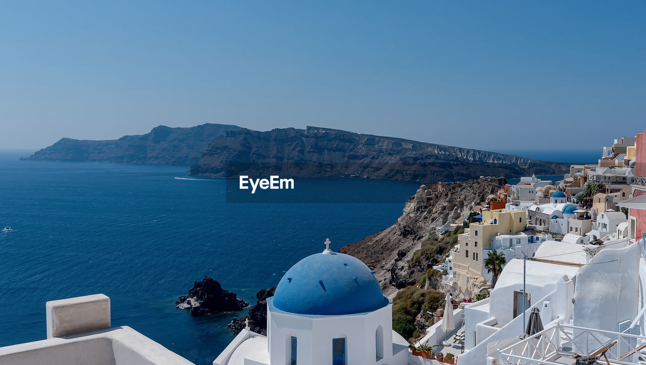 PANORAMIC VIEW OF SEA AND BUILDINGS AGAINST SKY