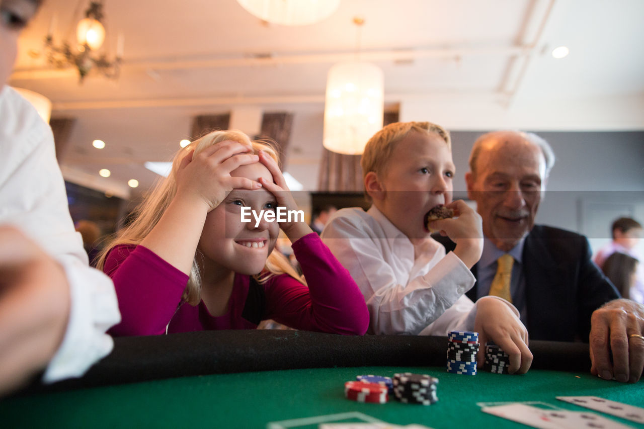 TWO PEOPLE SITTING ON TABLE