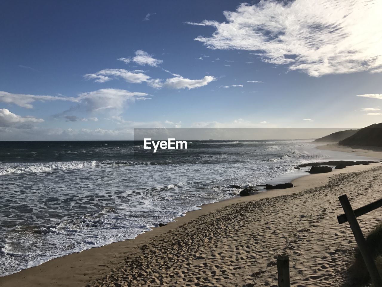 PANORAMIC VIEW OF BEACH AGAINST SKY