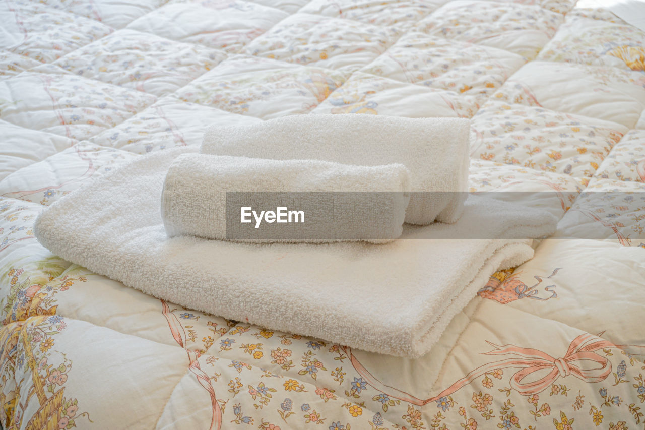 High angle view of towels on bed at home