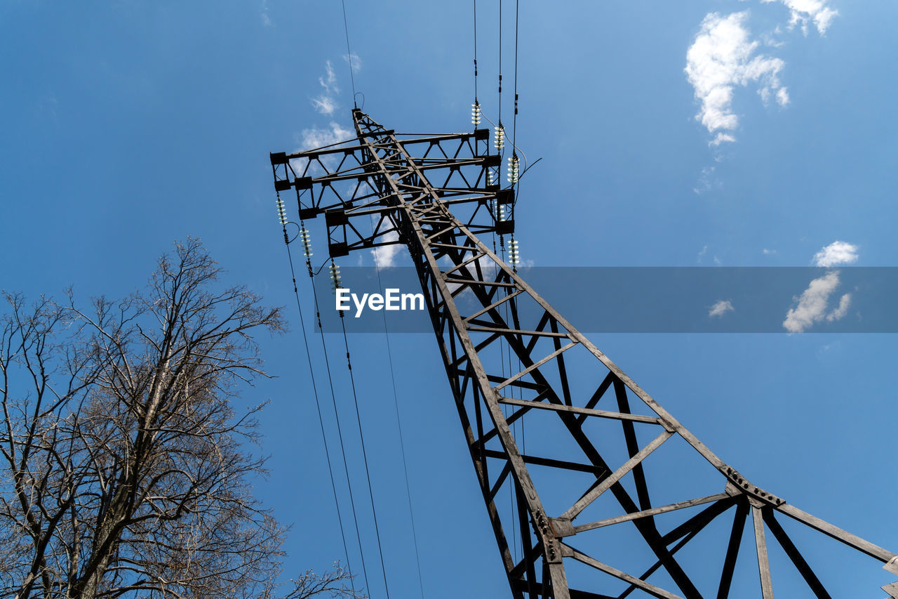 low angle view of crane against blue sky