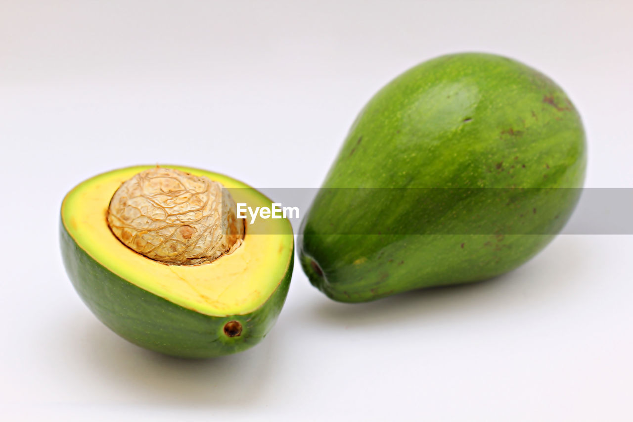 Close-up of avocado against white background