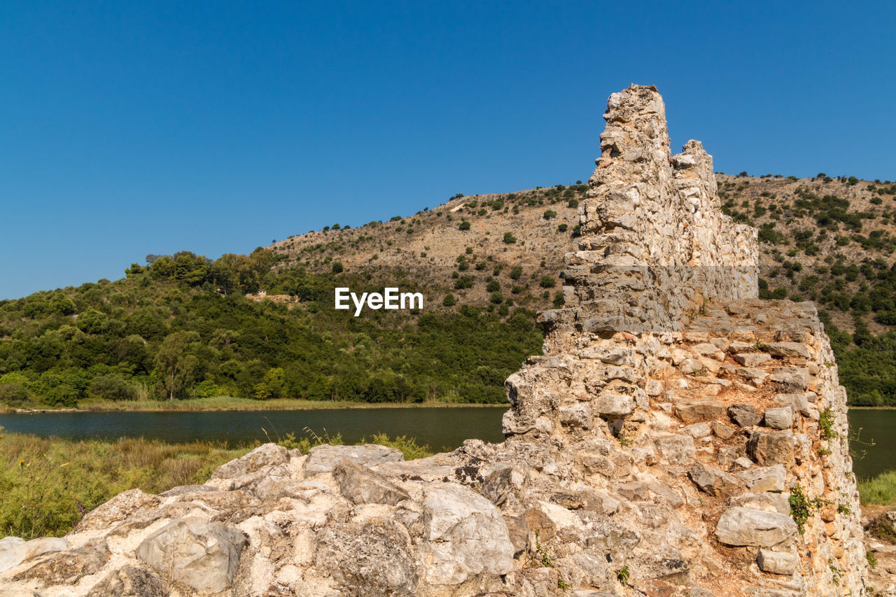 SCENIC VIEW OF ROCK AGAINST SKY