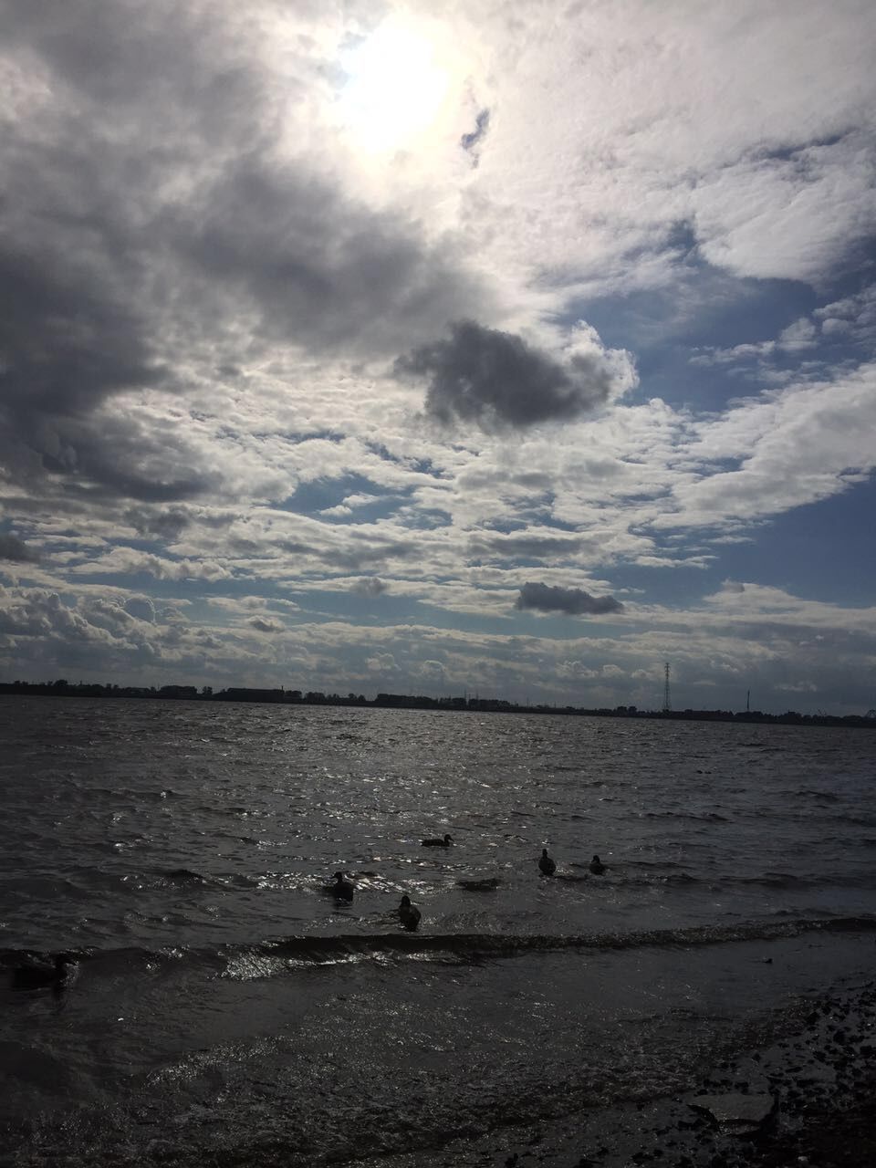 CALM SEA AGAINST CLOUDY SKY