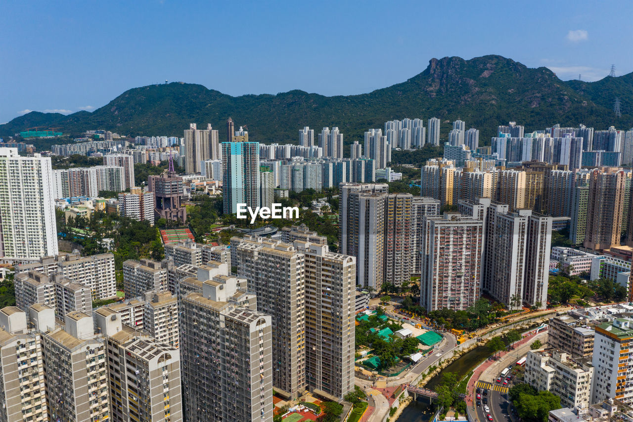 HIGH ANGLE VIEW OF BUILDINGS AGAINST SKY