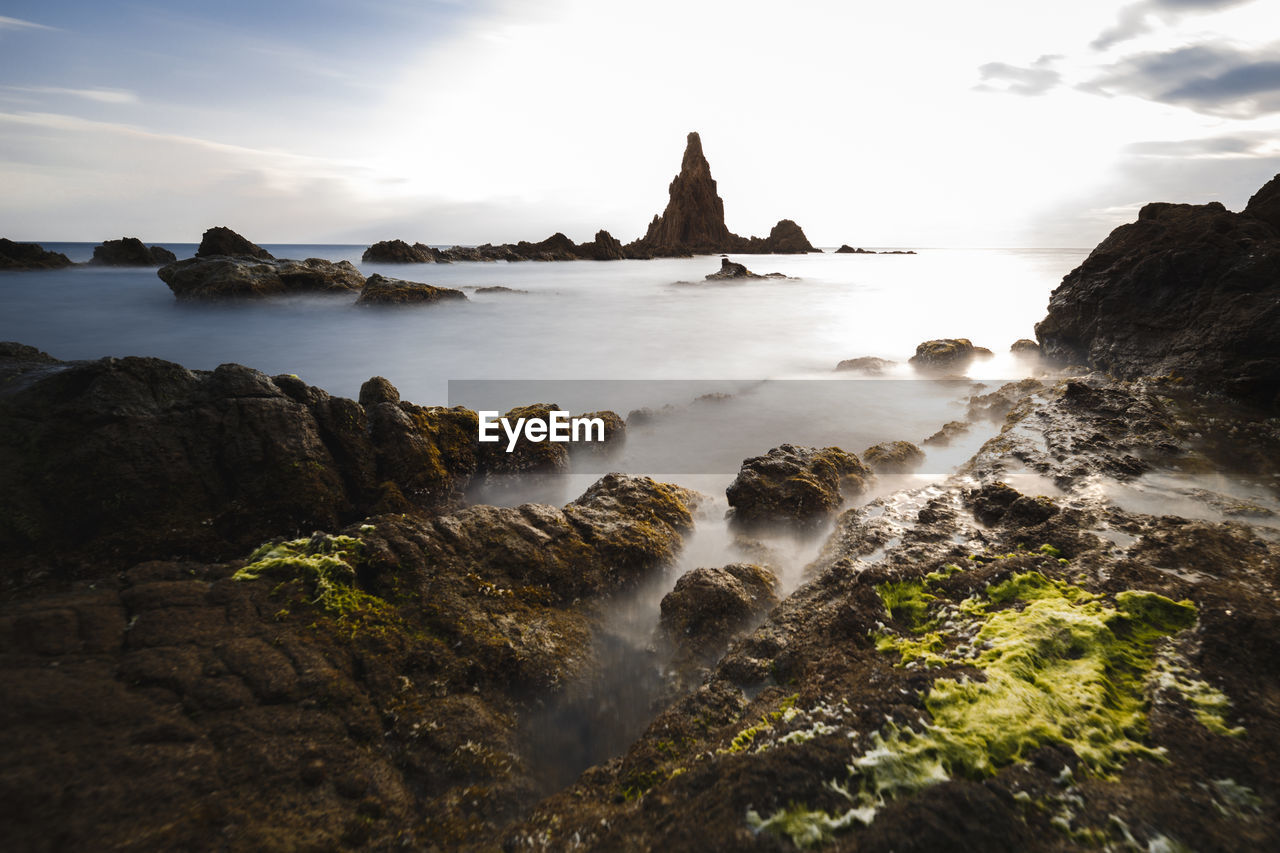 Scenic view of rocks against sky