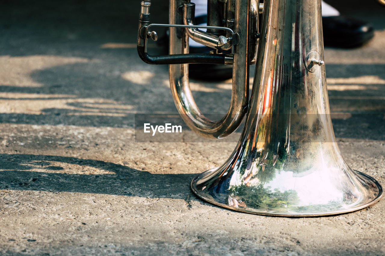 Close-up of trumpet on road