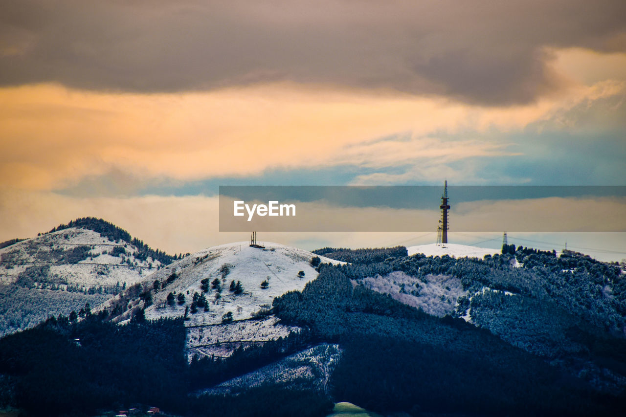 Scenic view of mountains against sky during sunset