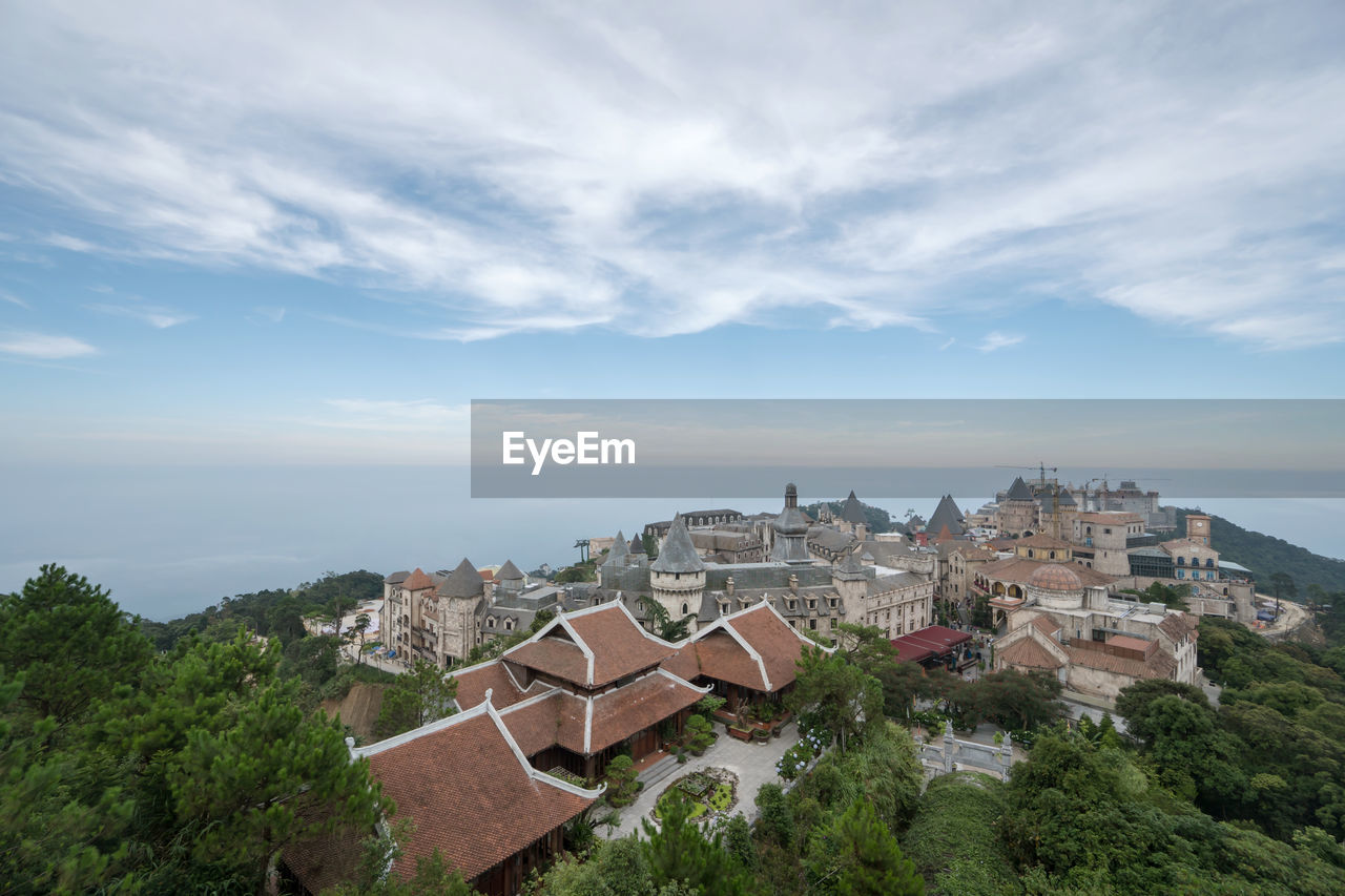 High angle view of buildings in city against sky