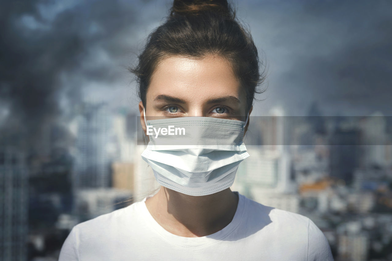 close-up portrait of young woman wearing mask