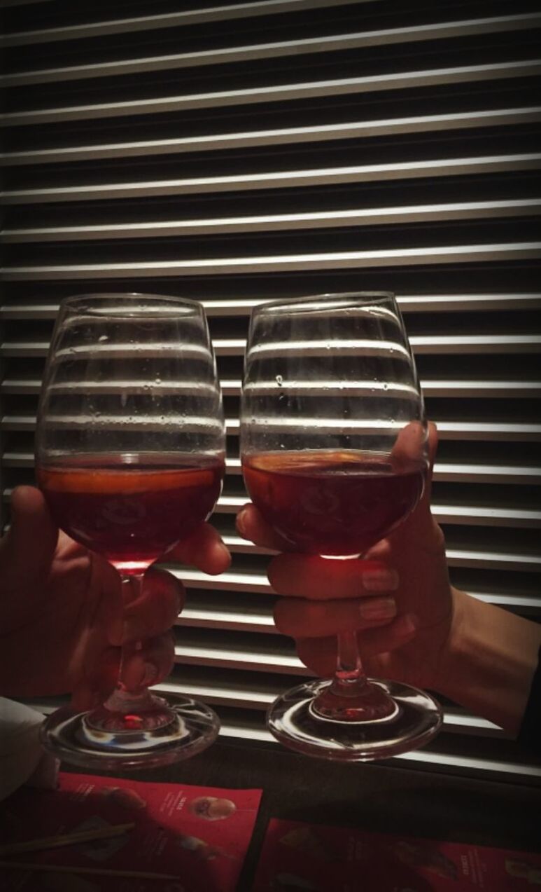 CLOSE-UP OF WINE GLASSES ON TABLE