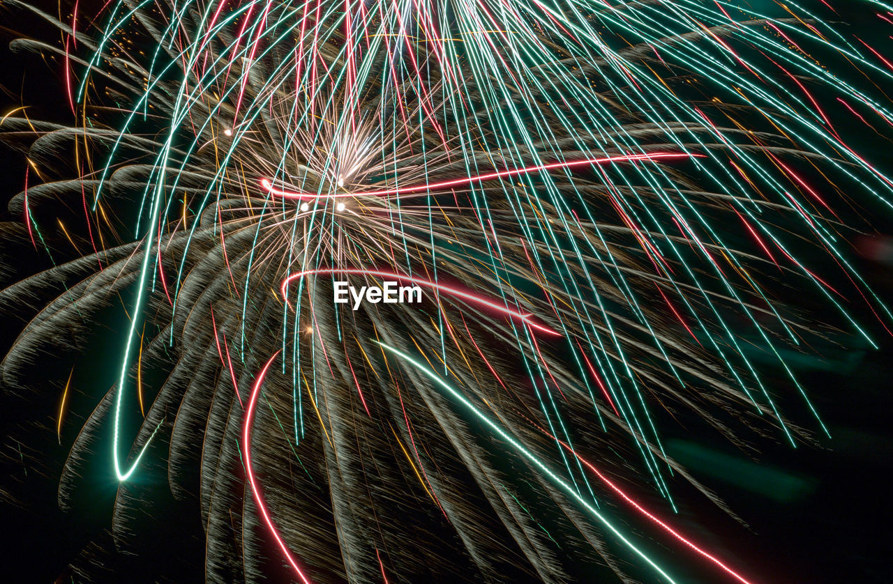 Low angle view of light trails at night