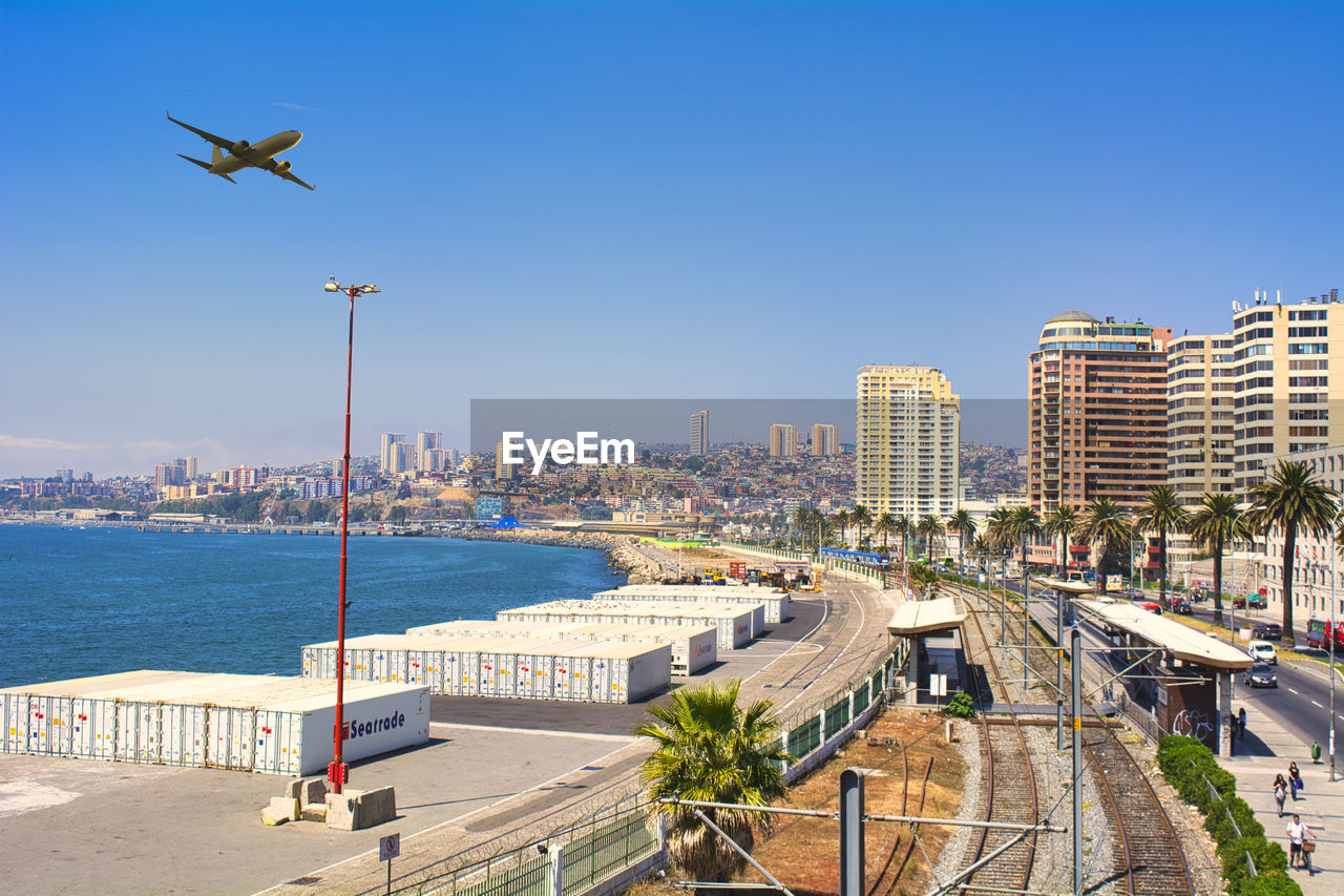 High angle view of cityscape against clear blue sky