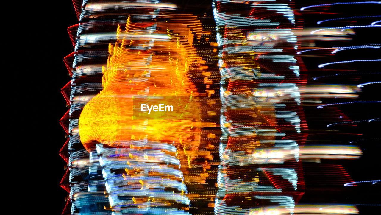 Long exposure of ferris wheel at night