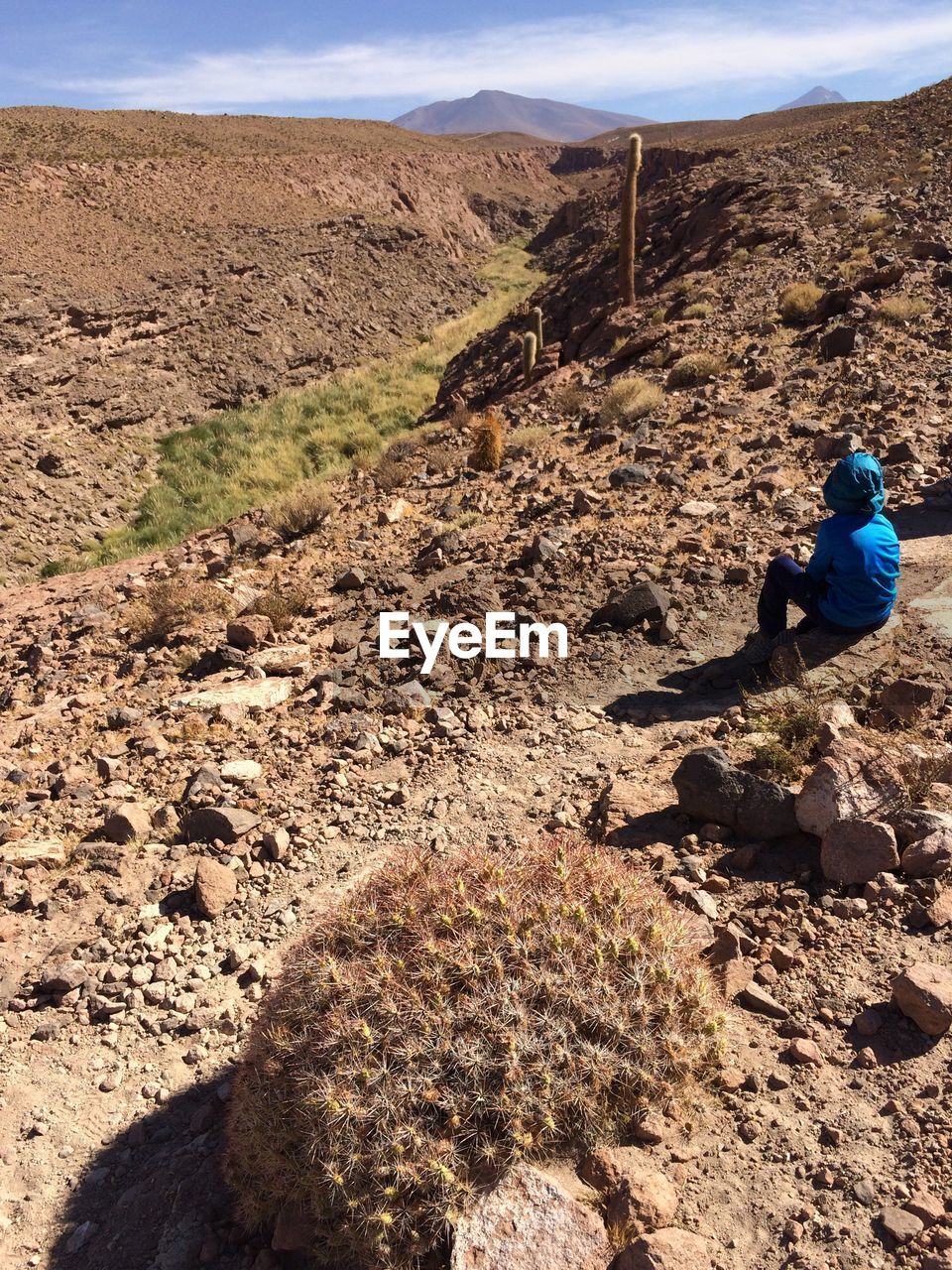 Person sitting on mountain