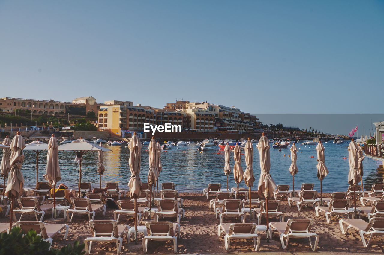 Beach against clear sky at golden hour