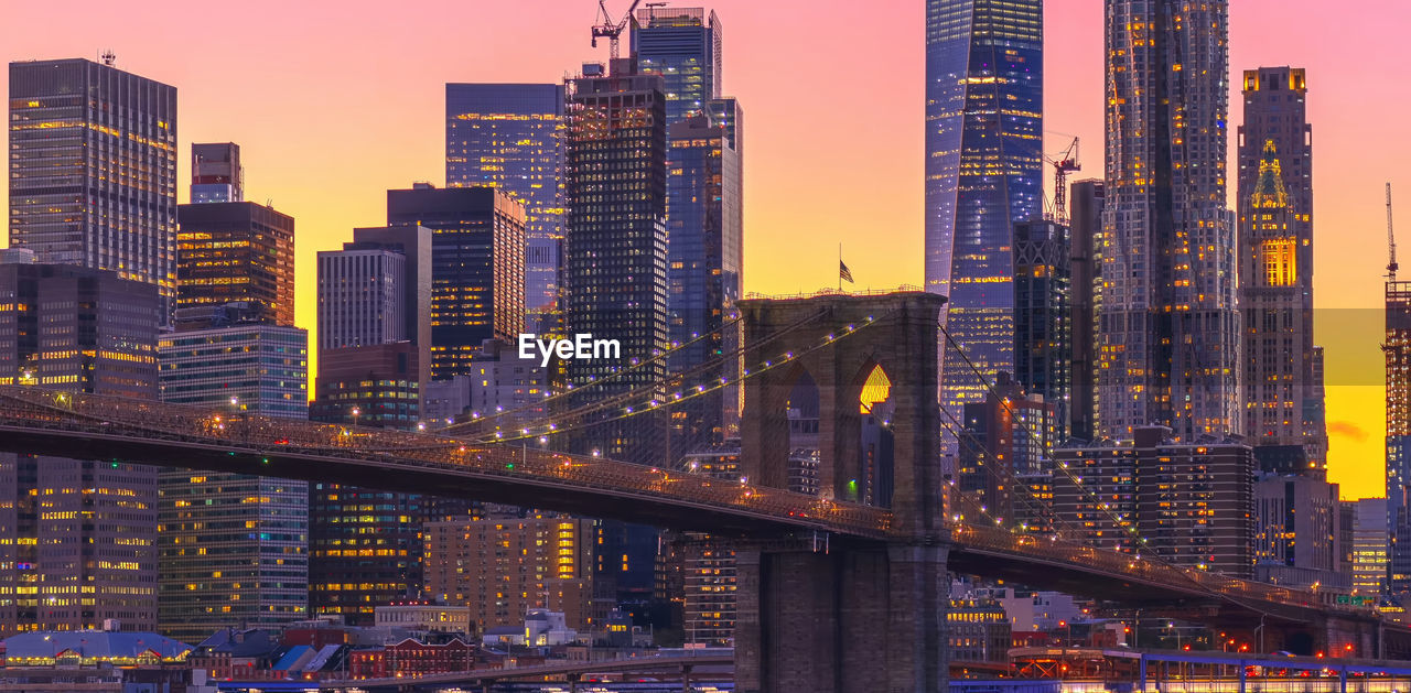 illuminated cityscape against sky at night