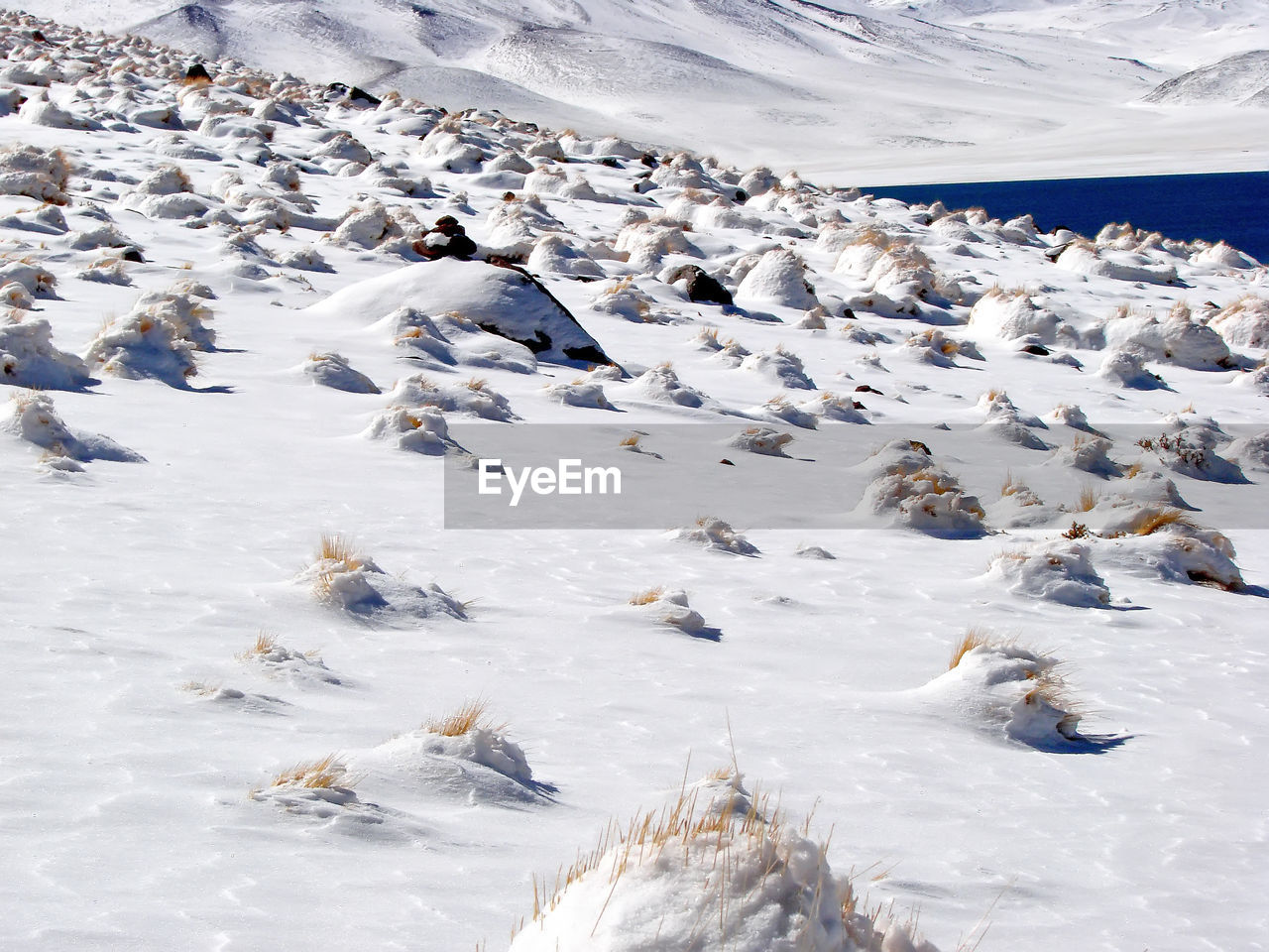 HIGH ANGLE VIEW OF FROZEN WATER IN WINTER