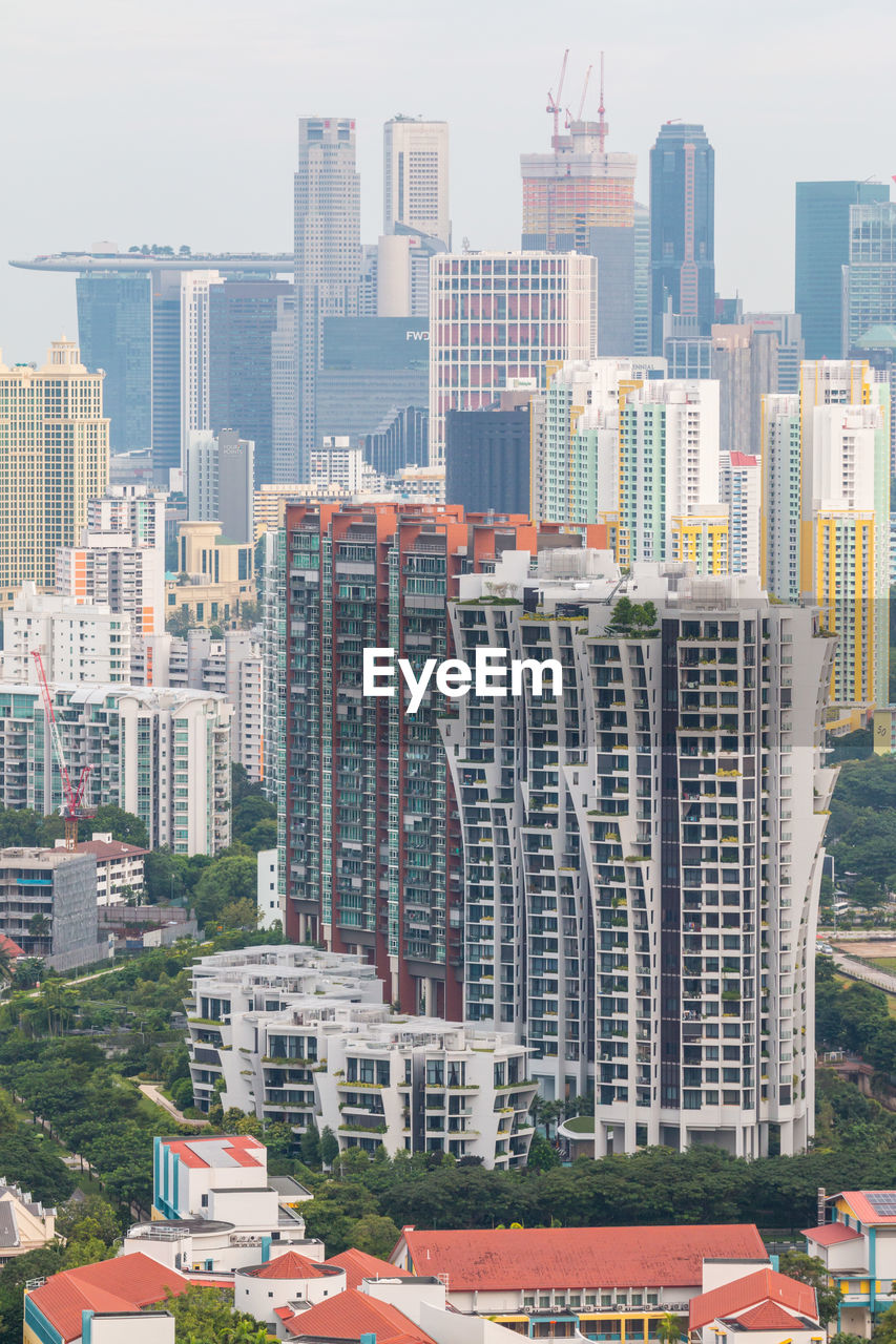 VIEW OF BUILDINGS IN CITY AGAINST SKY