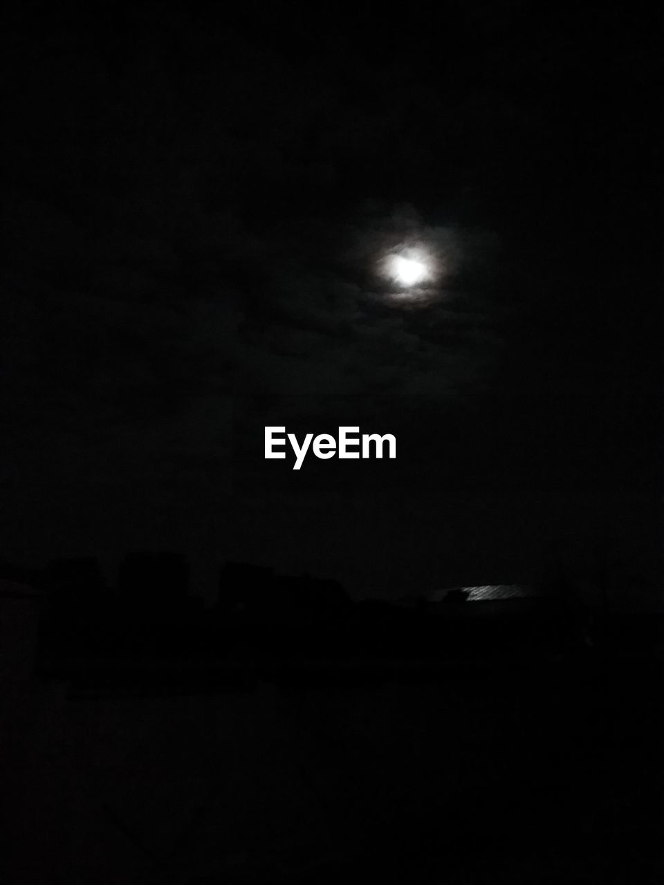 LOW ANGLE VIEW OF MOON AGAINST SKY AT NIGHT