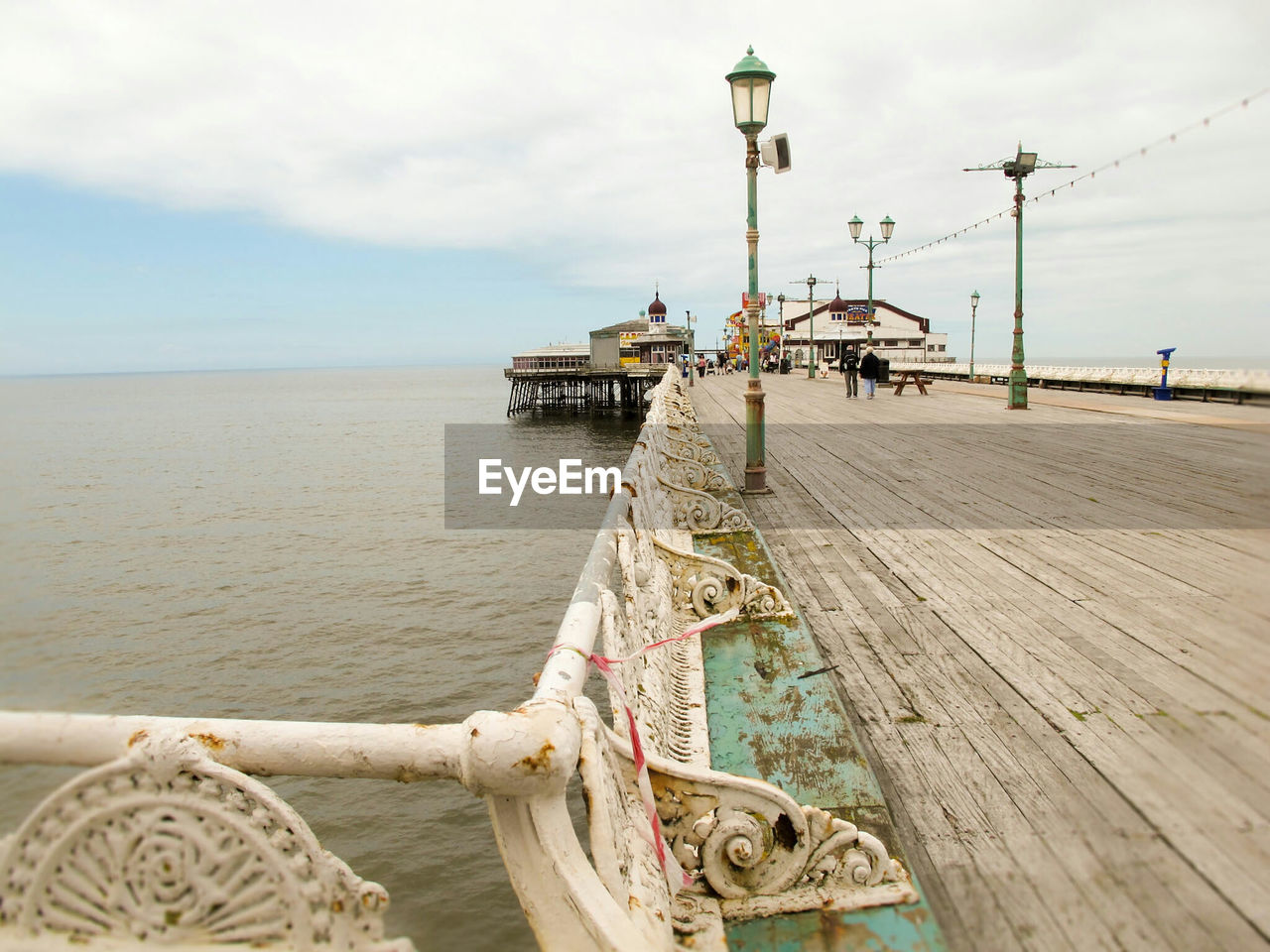 Pier over sea against sky