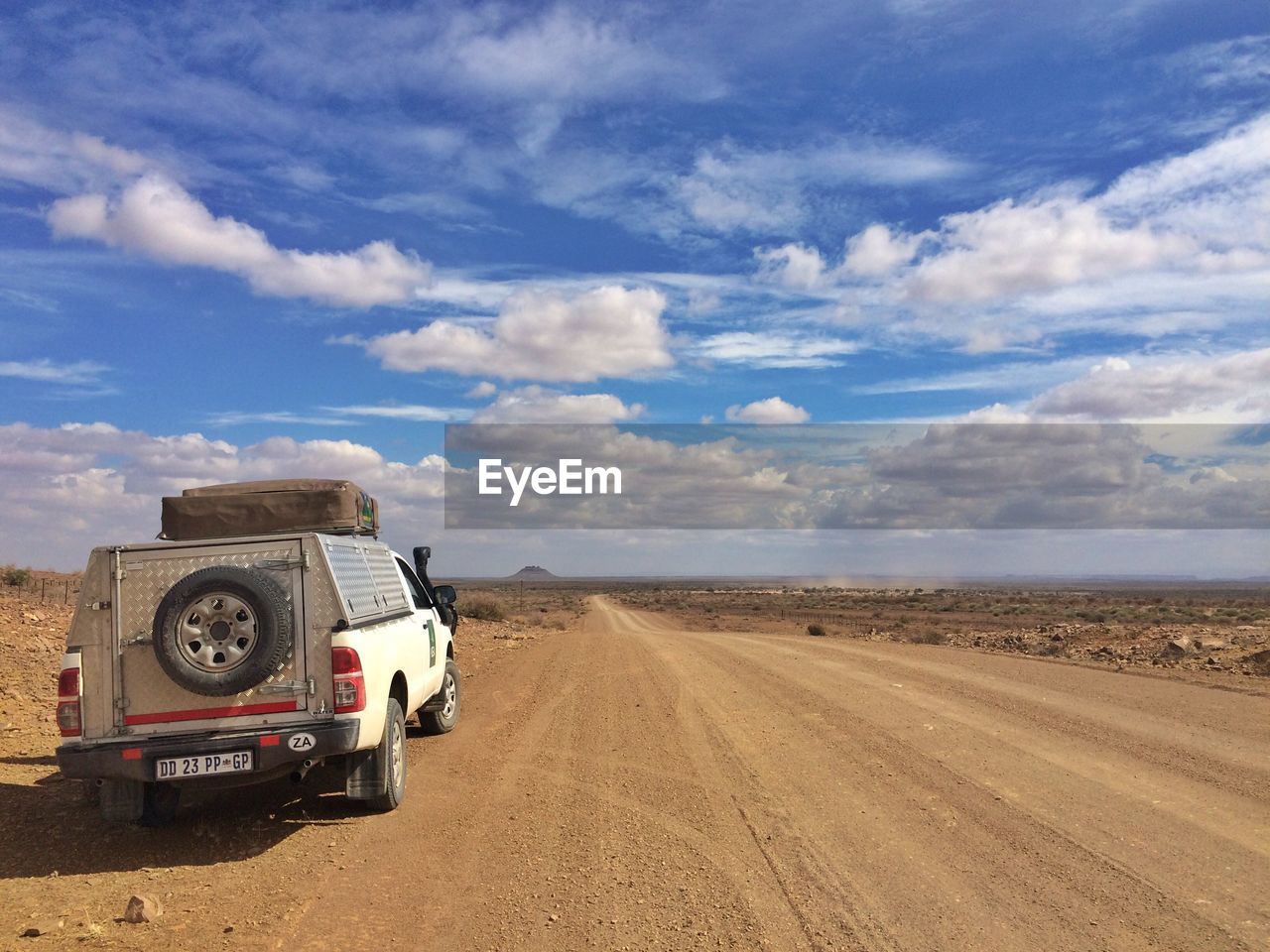 VIEW OF ROAD PASSING THROUGH LANDSCAPE