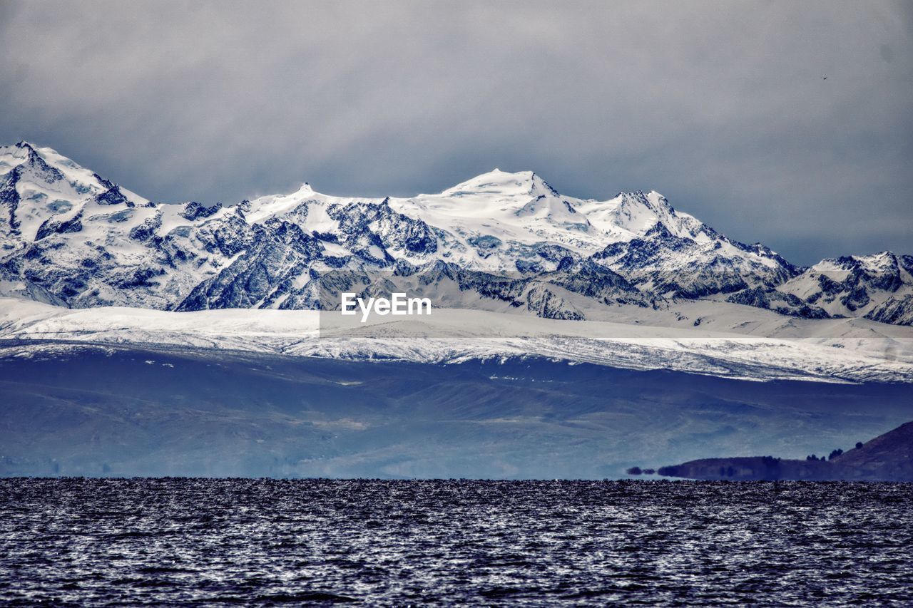 Scenic view of snowcapped mountains against sky