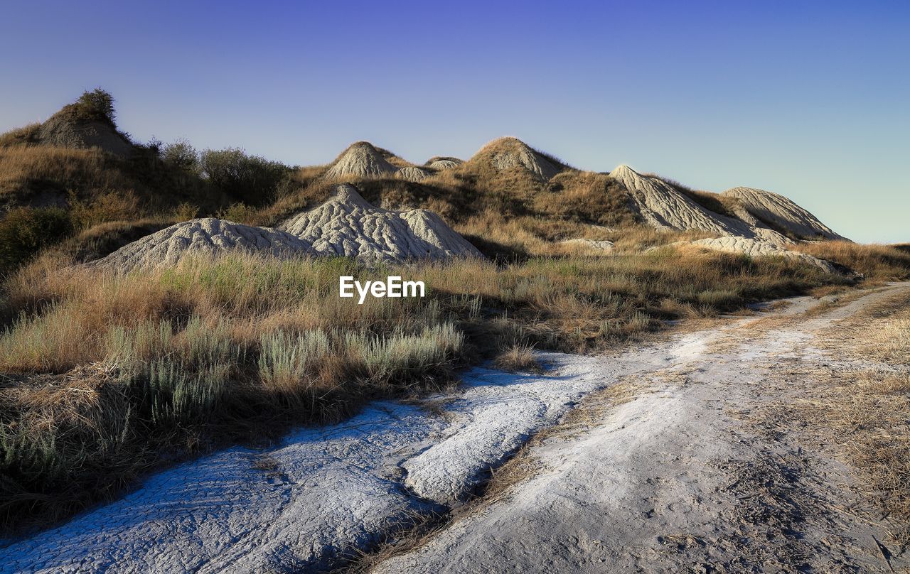 Scenic view of landscape against clear blue sky