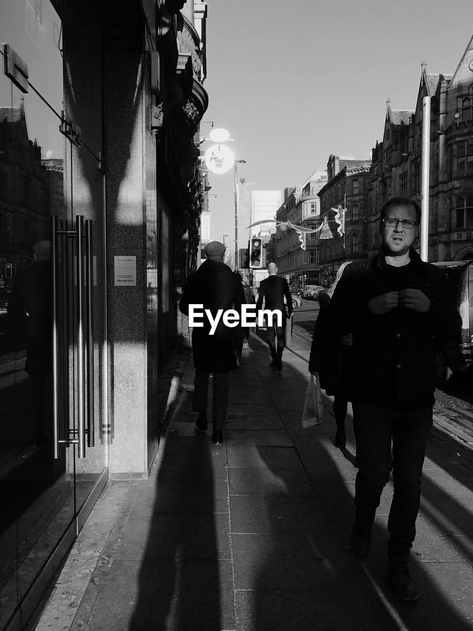 VIEW OF PEOPLE WALKING ON STREET