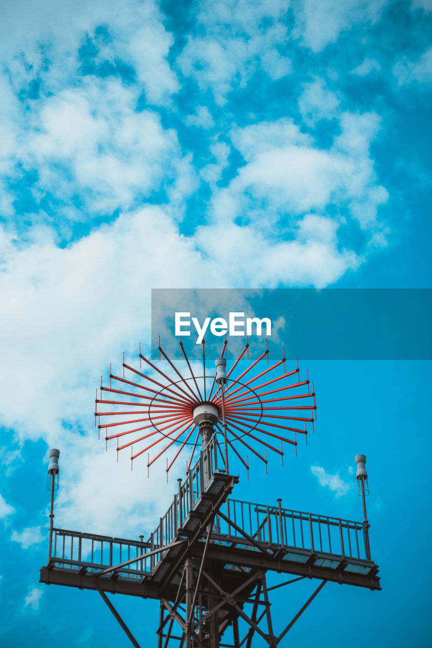 LOW ANGLE VIEW OF WINDMILLS AGAINST SKY