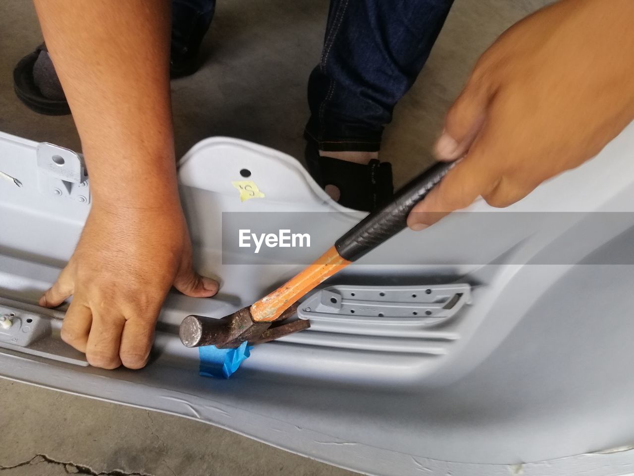 Midsection of man working in workshop