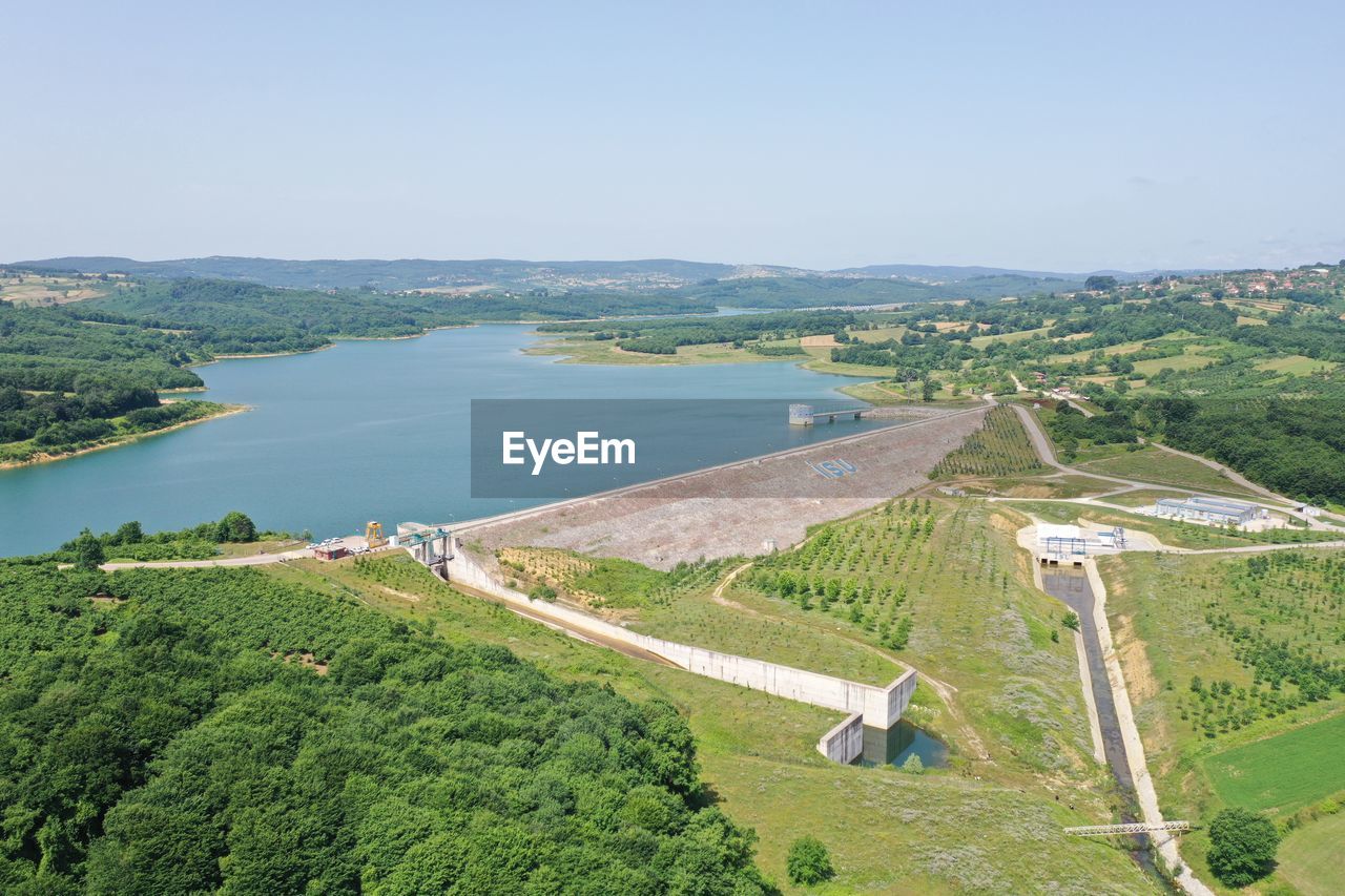 HIGH ANGLE VIEW OF LANDSCAPE AND SEA AGAINST SKY