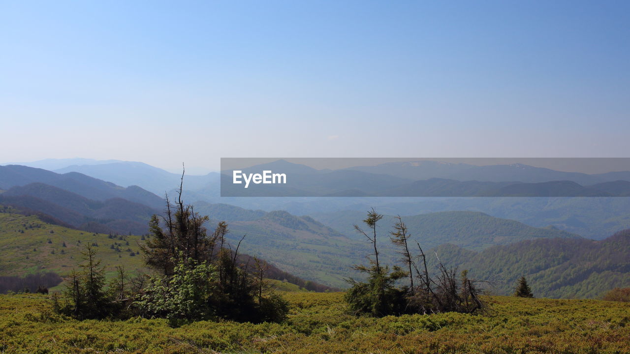 Scenic view of mountains against clear sky