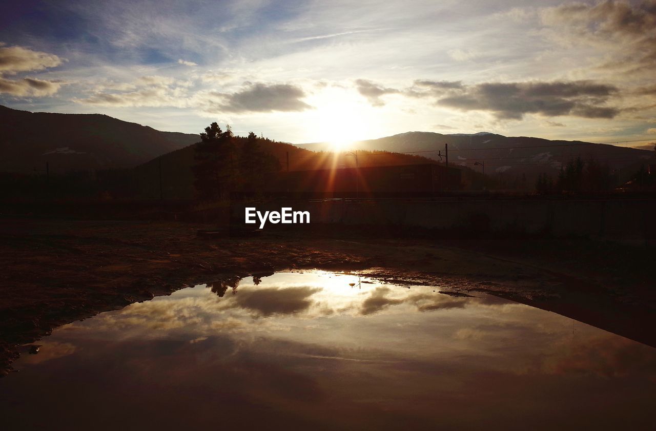 VIEW OF LANDSCAPE AGAINST SKY DURING SUNSET